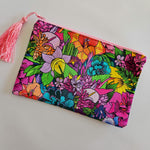 Assorted printed zip clutch