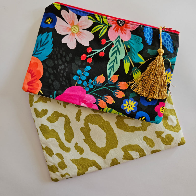 Assorted printed zip clutch