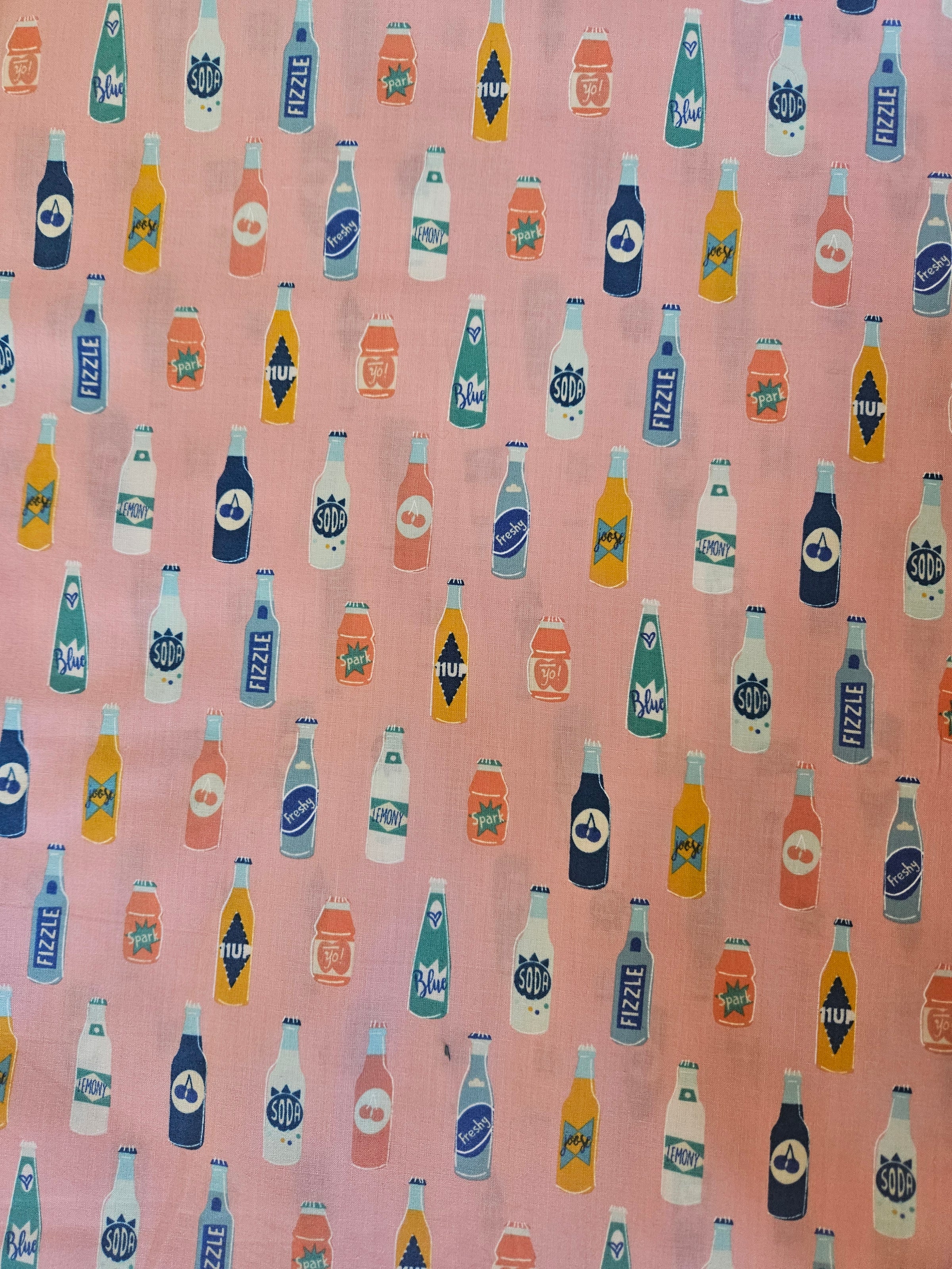 Pink soda bottles top