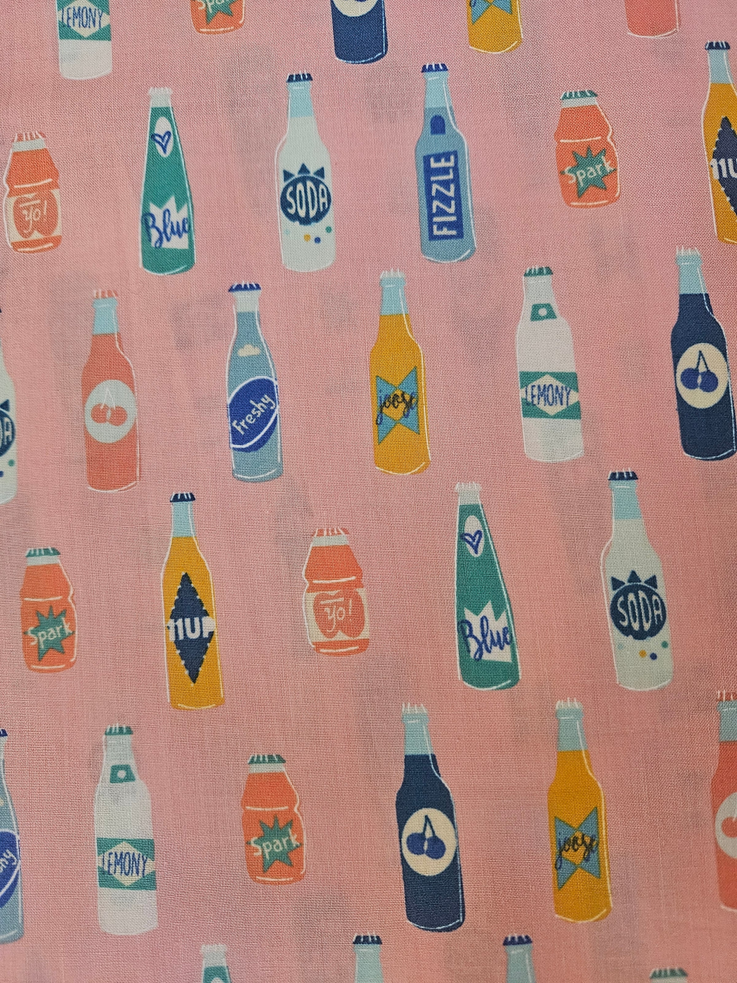 Pink soda bottles top