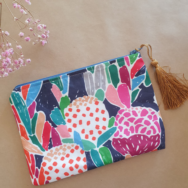 Assorted printed zip clutch